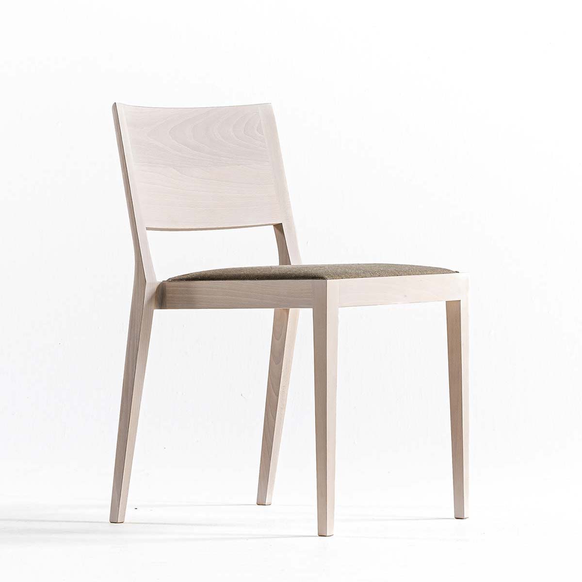 A chair in the forest by Time & Style