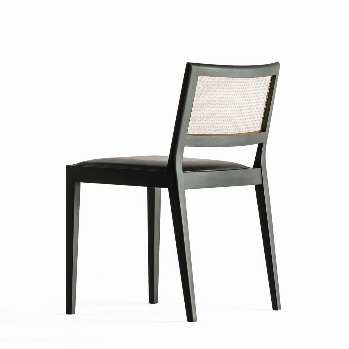 A chair outside the cage by Time & Style